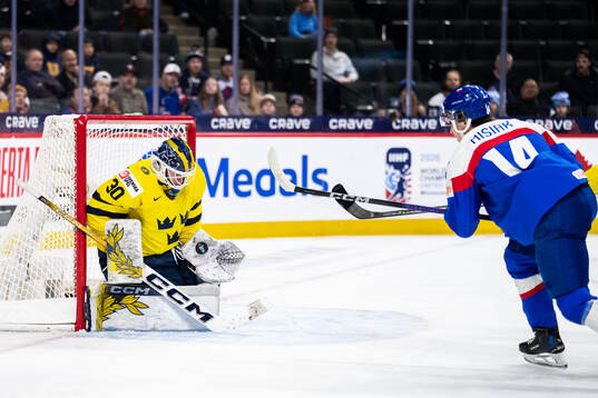 Goaltender Love Härenstam of Sweden and Alex Misiak of