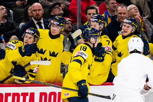 Victor Eklund of Sweden celebrates with team mates