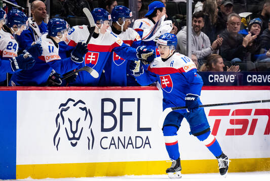 Tomas Pobezal of Slovakia celebrates with team mates