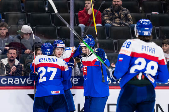 Tobias Tomik of Slovakia celebrates with team mates