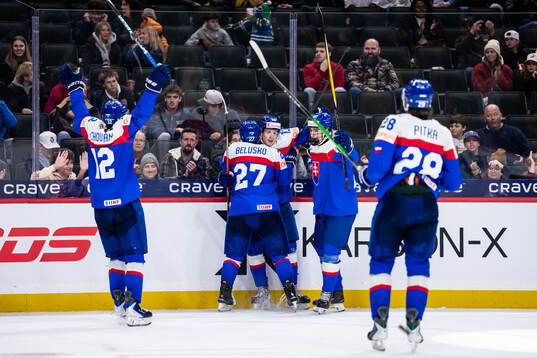 Tobias Tomik of Slovakia celebrates with team mates