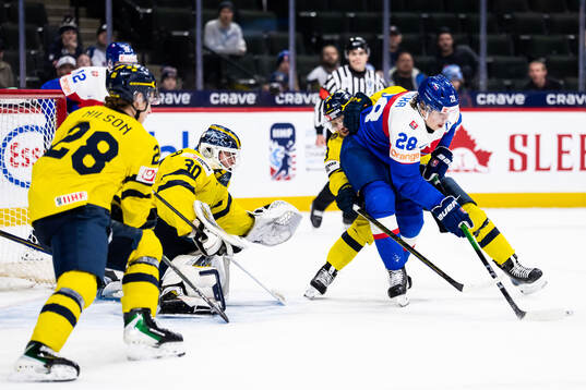 Eric Nilson, goaltender Love Härenstam and Felix Öhrqvist