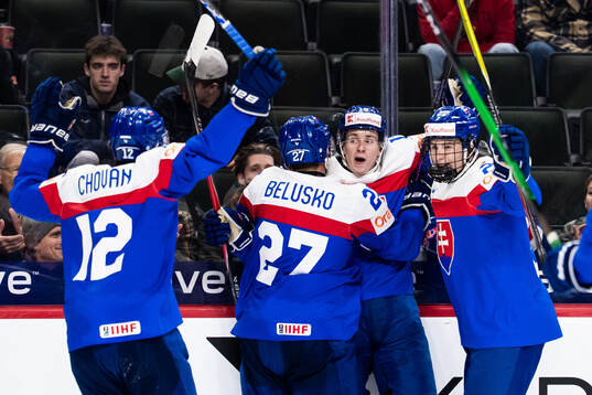 Tobias Tomik of Slovakia celebrates with team mates