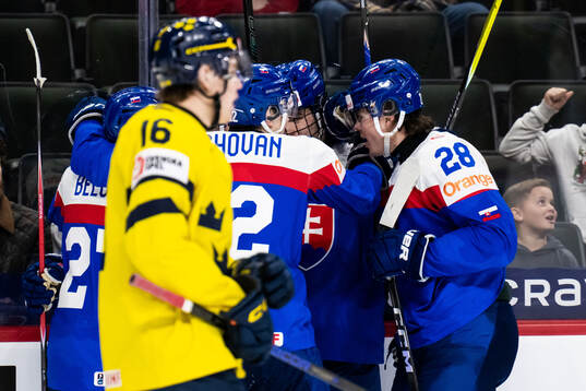 Tobias Tomik of Slovakia celebrates with team mates
