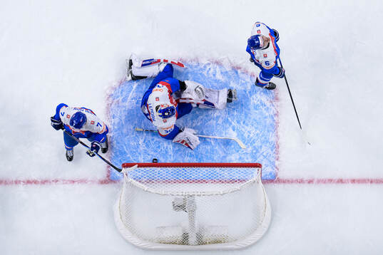 Adam Kalman, goaltender Alan Lendak and Michal Capos of