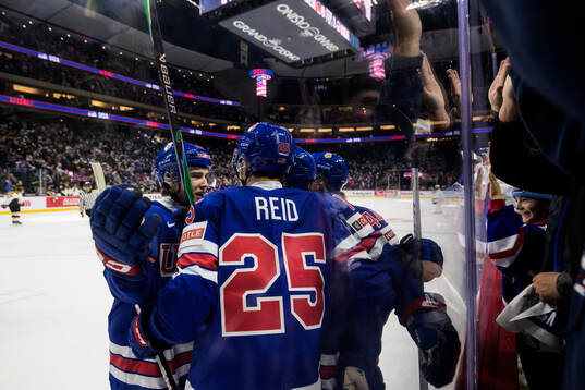 Chase Reid of USA celebrates with teammates