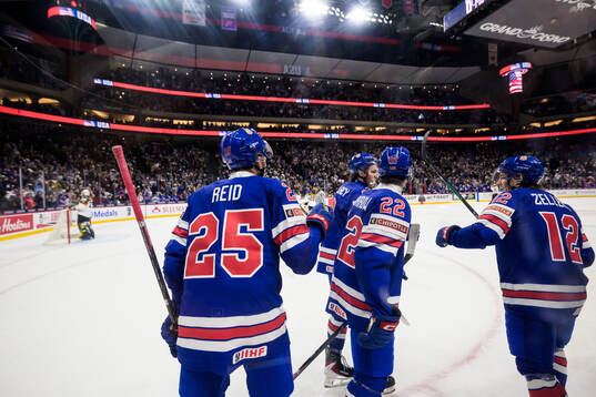 Chase Reid of USA celebrates with teammates