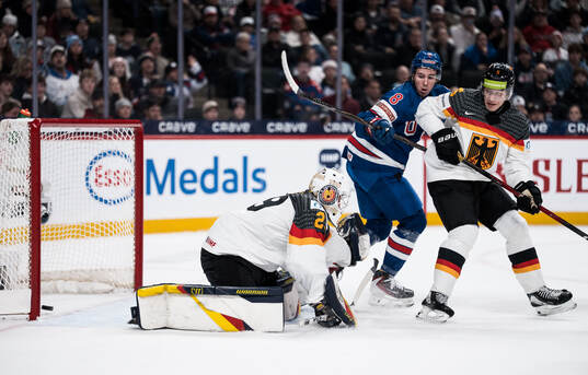 Goaltender Lennart Neisse of Germany and Anthony Spellacy
