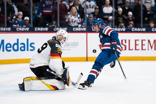 Goaltender Lennart Neisse of Germany and Cole McKinney of