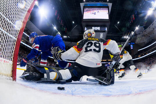 Will Horcoff of USA and goaltender Lennart Neisse of Germany