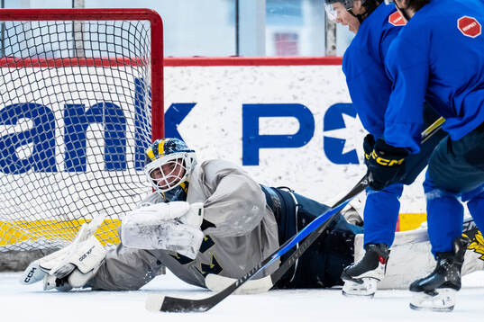 Goaltender Love Härenstam and Casper Juustovaara Karlsson