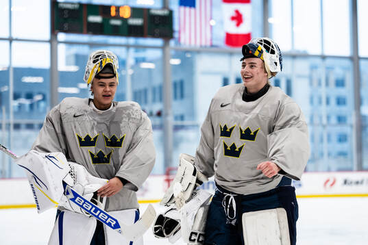 Goaltenders Herman Liv and Love Härenstam of Sweden at a
