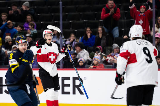 Beni Waidacher and Nolan Cattin of Switzerland celebrate