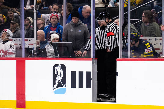 Referee Janne Wuorenheimo and referee Tomas Mejzlik