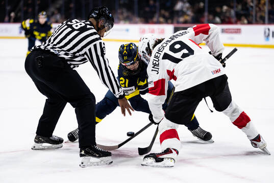 Viggo Björck of Sweden with a face-off against Jonah
