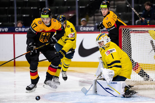 Lenny Boos of Germany and goaltender Herman Liv of Sweden