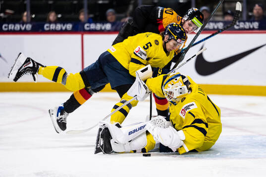 Sascha Boumedienne and goaltender Herman Liv of Sweden