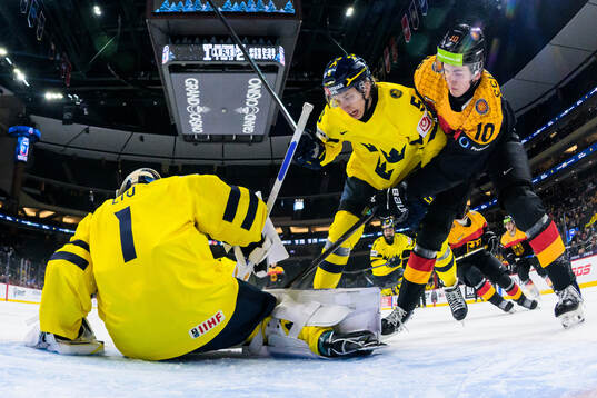 Goaltender Herman Liv and Sascha Boumedienne of Sweden are