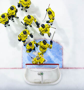 Players of Sweden celebrate with goaltender Herman Liv