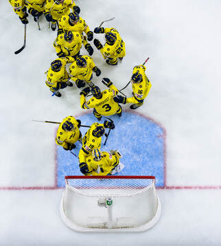 Players of Sweden celebrate with goaltender Herman Liv
