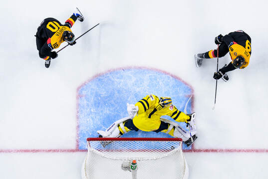 Elias Pul of Germany scores the 1-1 goal behind goaltender