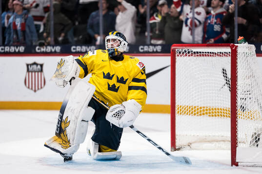Goaltender Love Härenstam of Sweden looks dejected