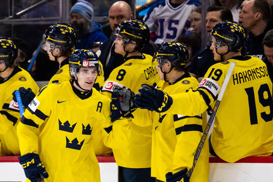 Lucas Pettersson of Sweden celebrates with teammates