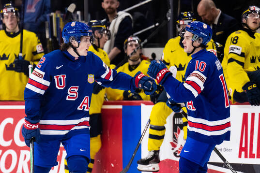 Will Zellers and James Hagens of USA celebrate the 2-5 goal