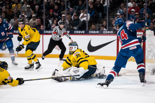 Goaltender Love Härenstam of Sweden and Will Horcoff of USA