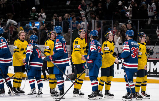 Players of Sweden and USA thank each other