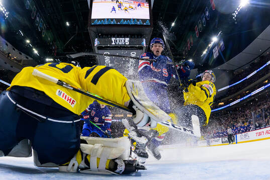 Brodie Ziemer of USA tackles Linus Eriksson of Sweden
