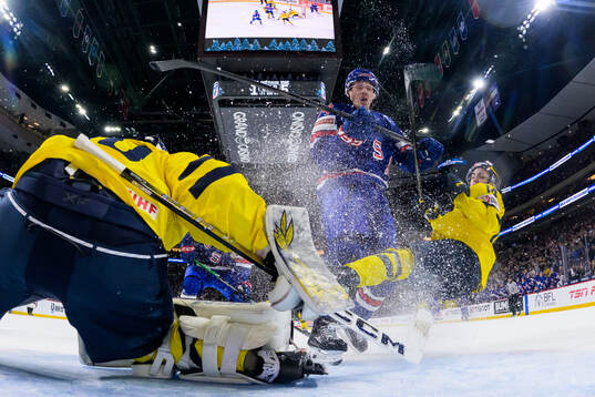 Brodie Ziemer of USA tackles Linus Eriksson of Sweden