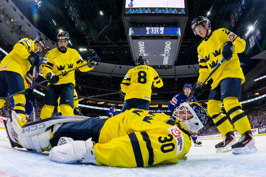 Goaltender Love Härenstam of Sweden covers the puck