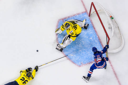 Jack Berglund and goaltender Love Härenstam of Sweden are