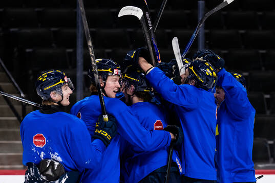 Players of Sweden celebrate at a practice session