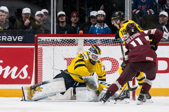 Dmitrijs Dilevka of Latvia against goaltender Love