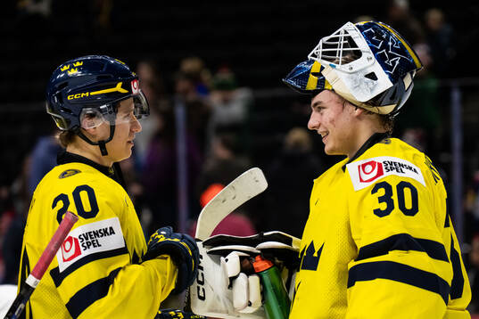 Alfons Freij and goaltender Love Härenstam of Sweden