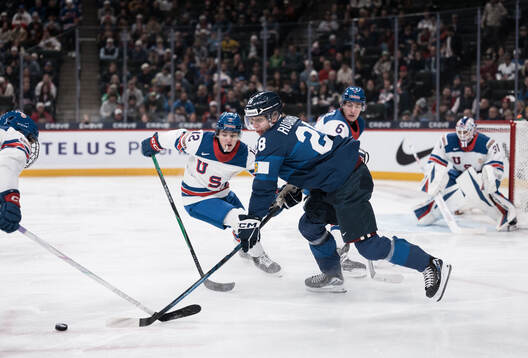 Will Zellers of USA and Heikki Ruohonen of Finland and Adam