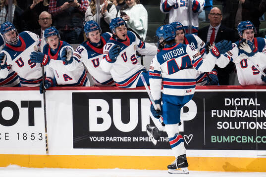 Cole Hutson of USA celebrates