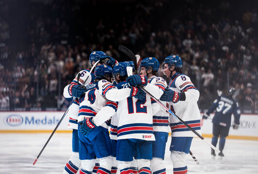 Cole Hutson of USA celebrates