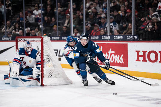Goaltender Nicholas Kempf and Kamil Bednarik of USA and