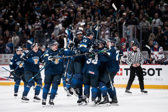 Players of Finland celebrate the 3-4 goal