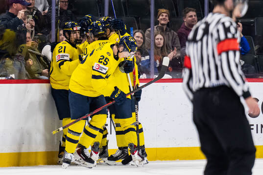 Eddie Genborg of Sweden celebrate with teammates