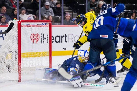 Jack Berglund of Sweden against goaltender Petteri Rimpinen