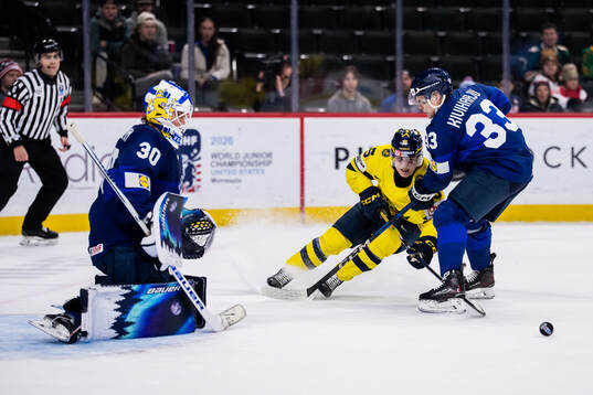 Ivar Stenberg of Sweden against goaltender Petteri Rimpinen