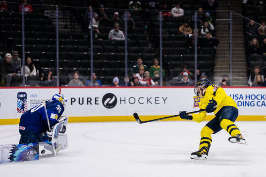 Goaltender Petteri Rimpinen of Finland saves against Viggo