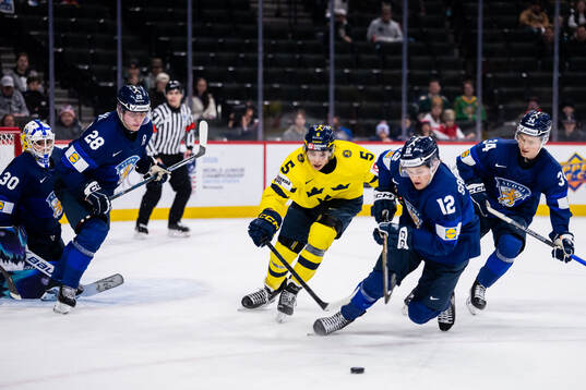 Sascha Boumedienne of Sweden against goaltender Petteri
