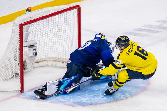 Goaltender Petteri Rimpinen of Finland saves against Anton