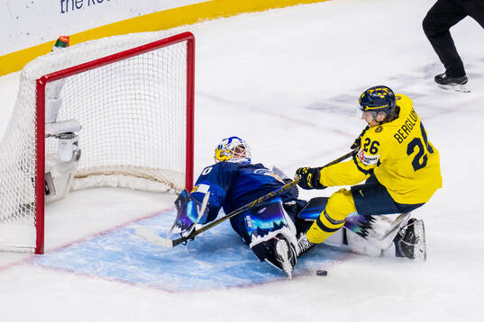 Goaltender Petteri Rimpinen of Finland and Jack Berglund of