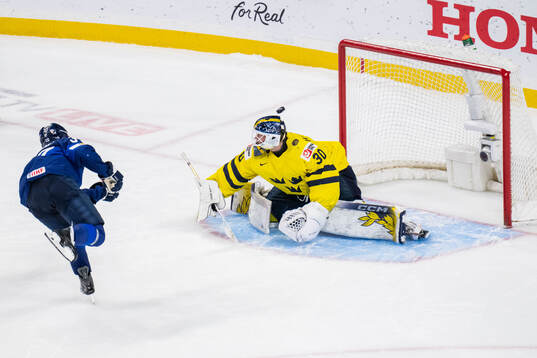 Matias Vanhanen of Finland and goaltender Love Härenstam